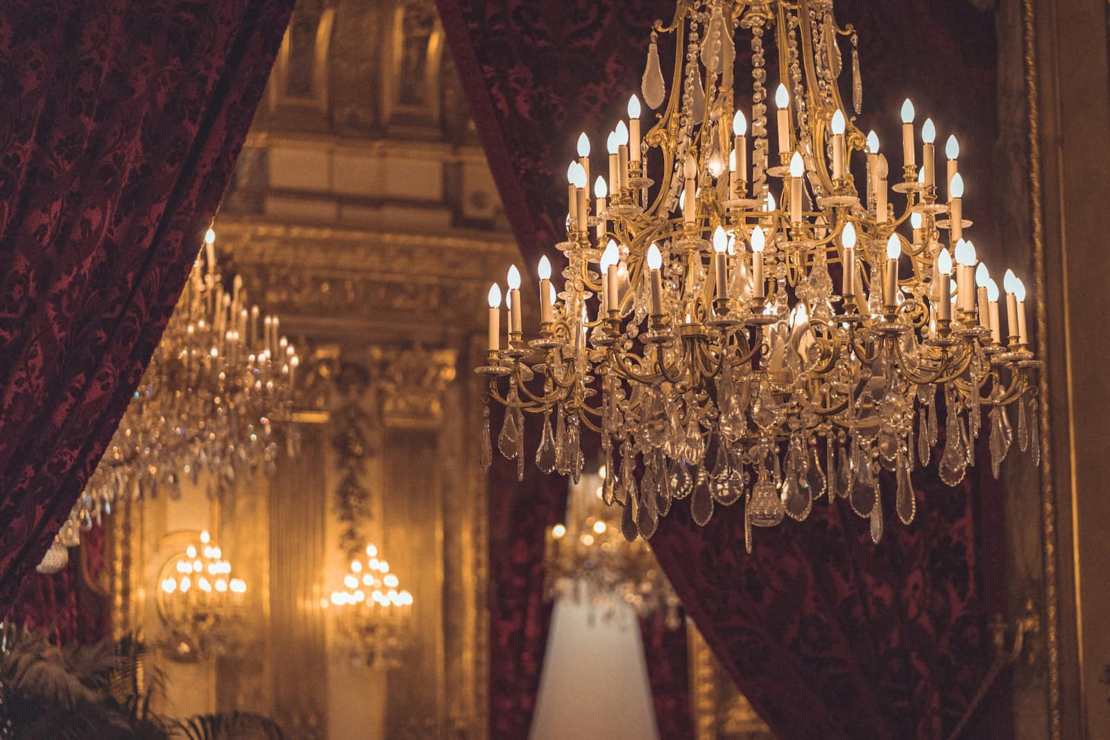Grand chandelier in a formal venue representing the future of wedding planning technology